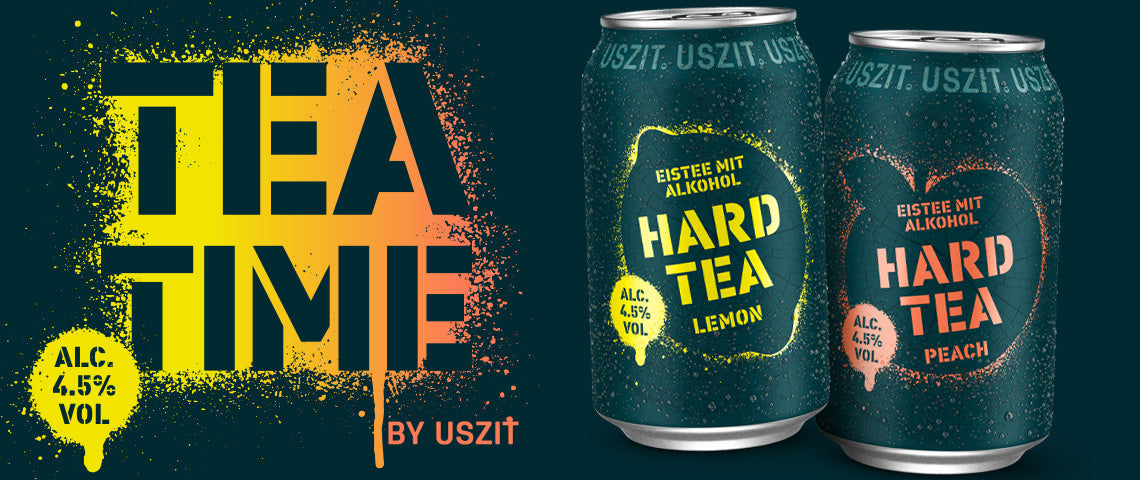 DE: USZIT Hard Tea Lemon Dose mit grafischem Design auf dunklem Hintergrund FR: Canette USZIT Hard Tea Lemon avec design graphique sur fond sombre IT: Lattina USZIT Hard Tea Lemon con design grafico su sfondo scuro EN: USZIT Hard Tea Lemon can with graphic design on dark background